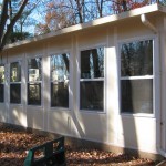 custom sun room addition built for home in the woods