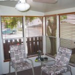 sun room with ceiling fan and patio furniture