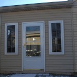 combo room with custom door, with matching siding