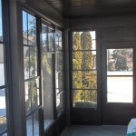 view of backyard from wraparound windows on custom combo room