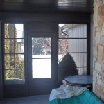 view of backyard from wraparound windows on custom combo room