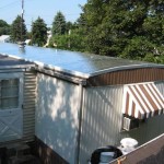 mobile home with old tin roof before re-roofing