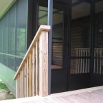 custom black three season room built attached to wooden deck